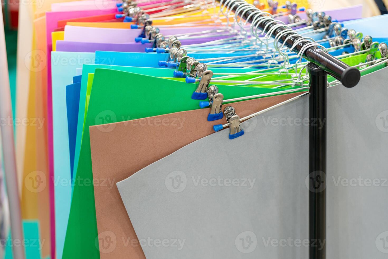 Sheets of decorative multi-colored paper on the showcase. photo