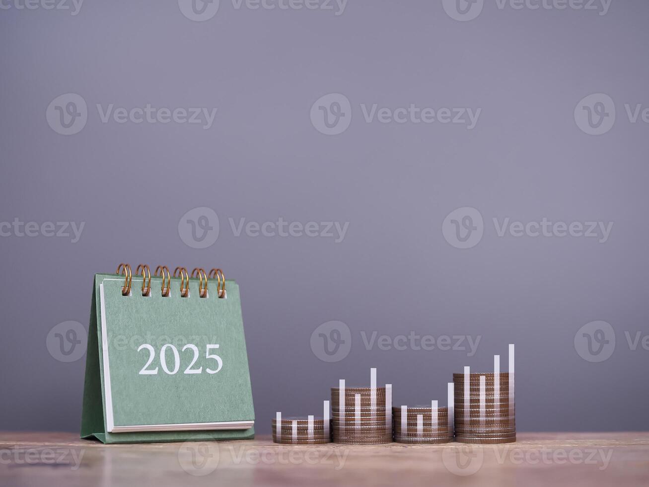 2025 desk calendar, Stack of coins with virtual increasing graph. The concept of business growth, Financial investment, Market stock, Profit return, Dividend and Business fund in year 2025 photo