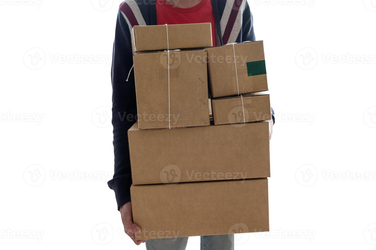 Man carrying stacked cardboard boxes or parcel box photo