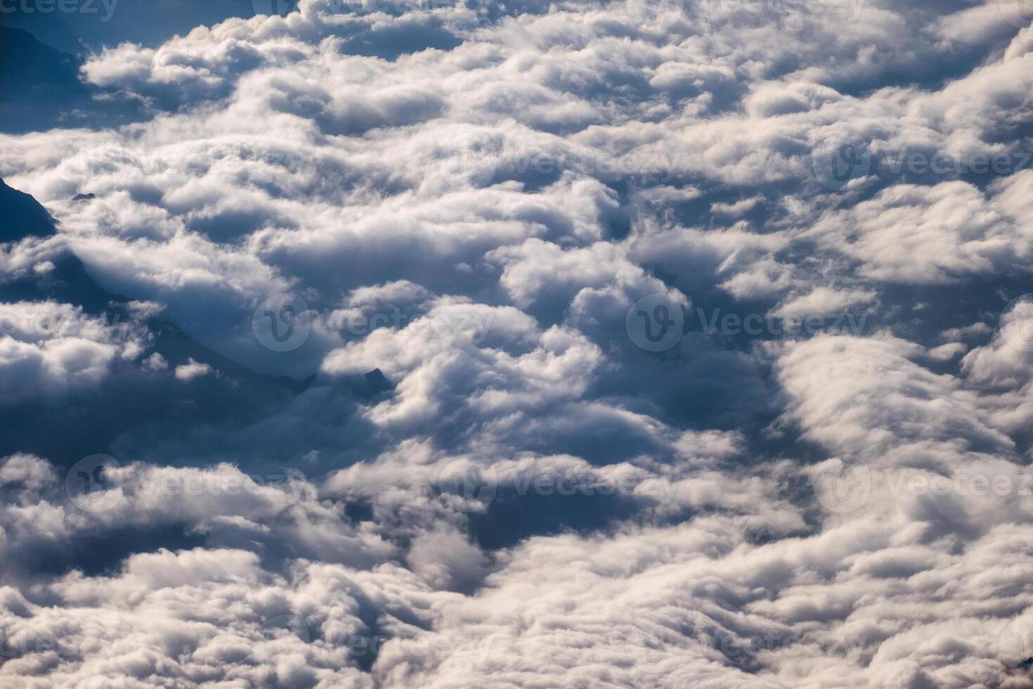 Above of fluffy clouds in the sky photo