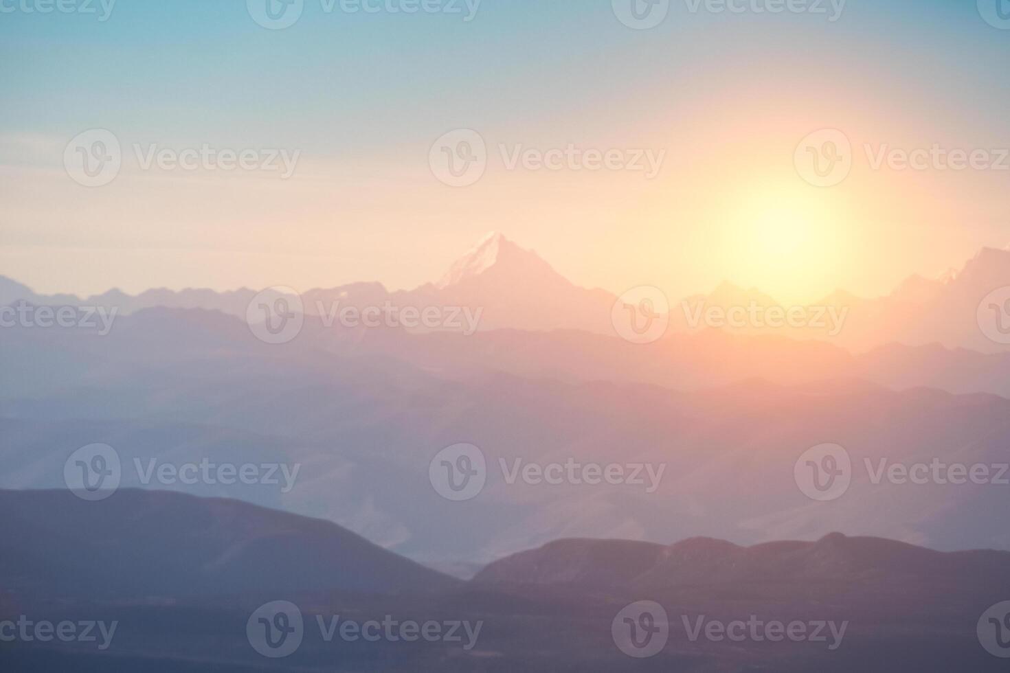Blurred of Peak on mountain range with sunrise at morning photo
