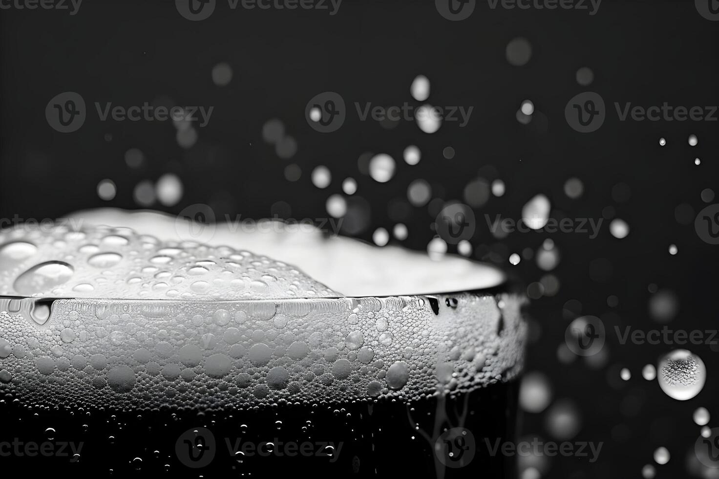 Clear macro image of water drops on black background, with hints of blue, representing fluidity and motion photo