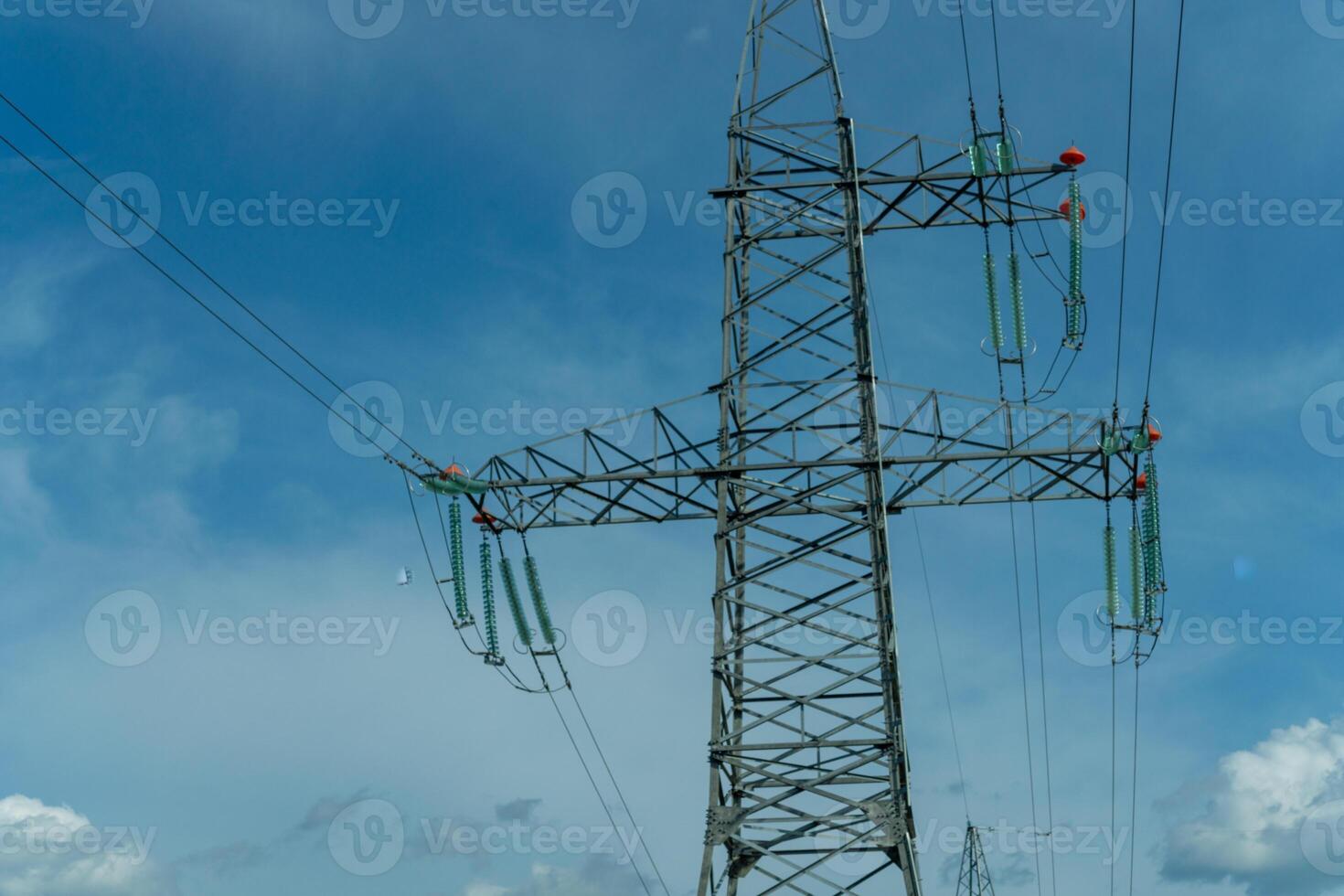 High voltage towers with sky background. Power line support with wires for electricity transmission. High voltage grid tower with wire cable at distribution station. Energy industry, energy saving photo