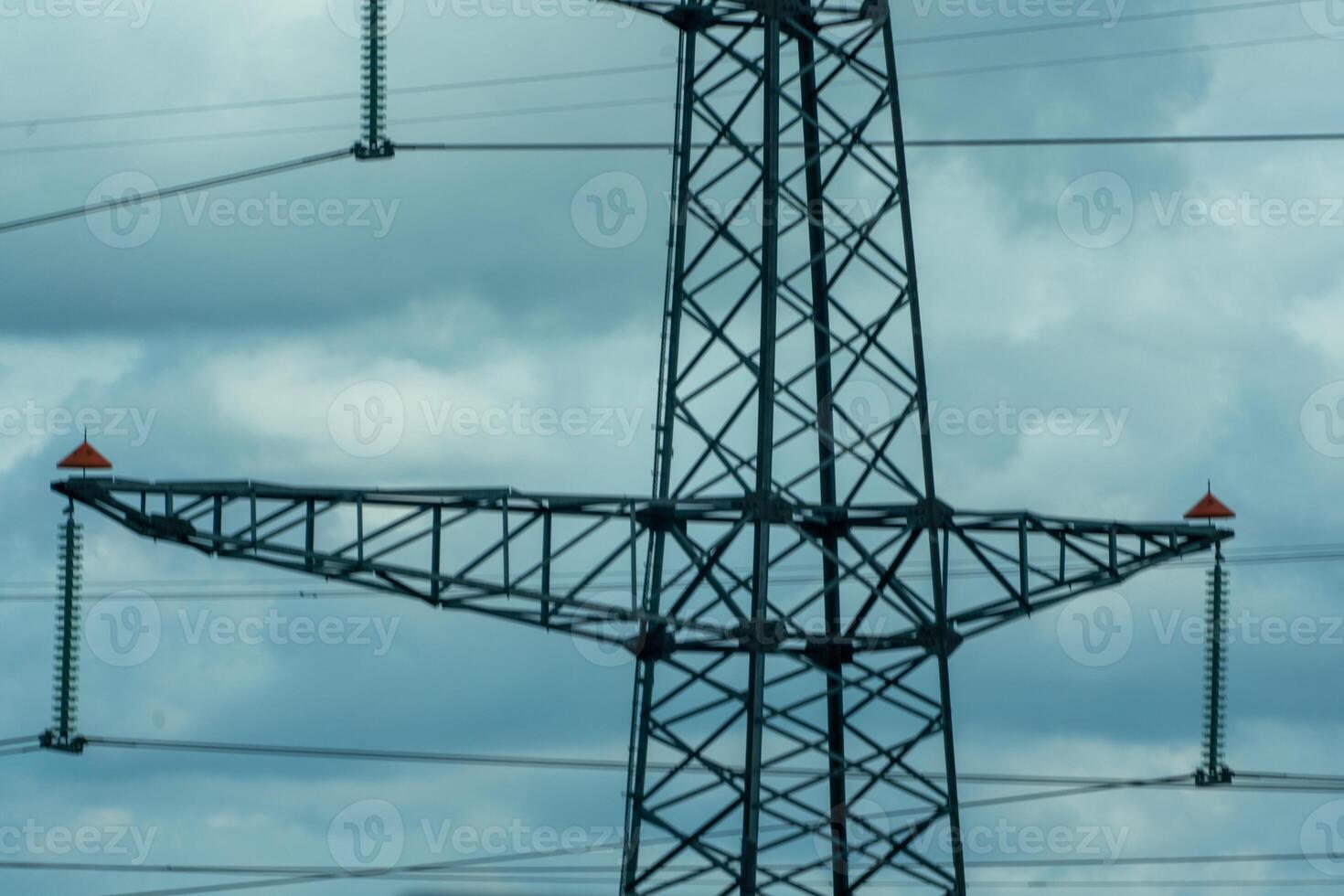 High voltage towers with sky background. Power line support with wires for electricity transmission. High voltage grid tower with wire cable at distribution station. Energy industry, energy saving photo