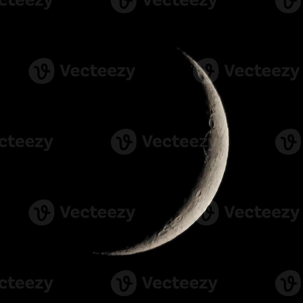 Waxing crescent moon seen with telescope photo