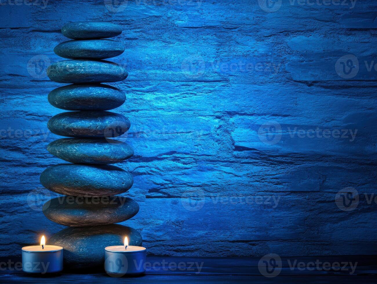 Tranquil zen background with stacked stones and illuminated candles photo