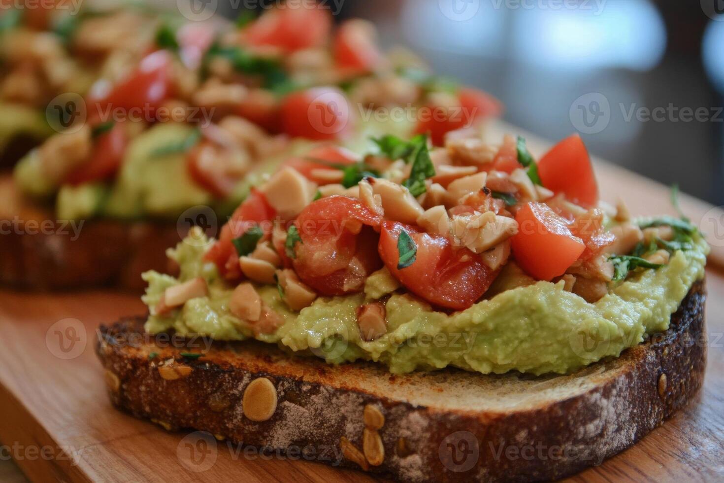 Delicious avocado hummus toast topped with fresh tomatoes and herbs photo