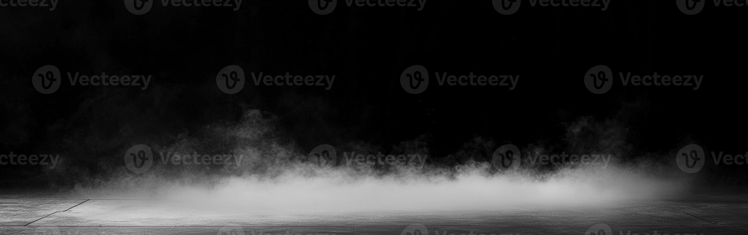 Mist forming on a dark surface in a low-lit environment photo