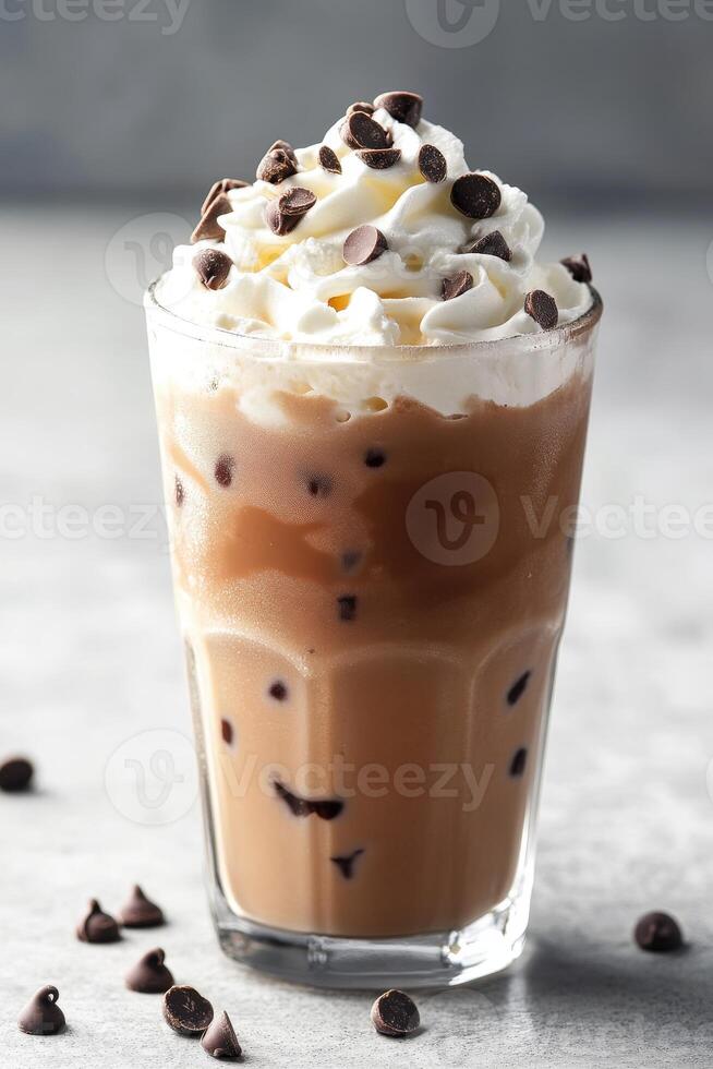 Creamy ice cream drink topped with whipped cream and chocolate chips photo