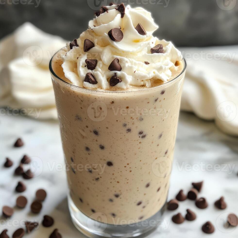 Delicious ice cream drink topped with whipped cream and chocolate chips photo