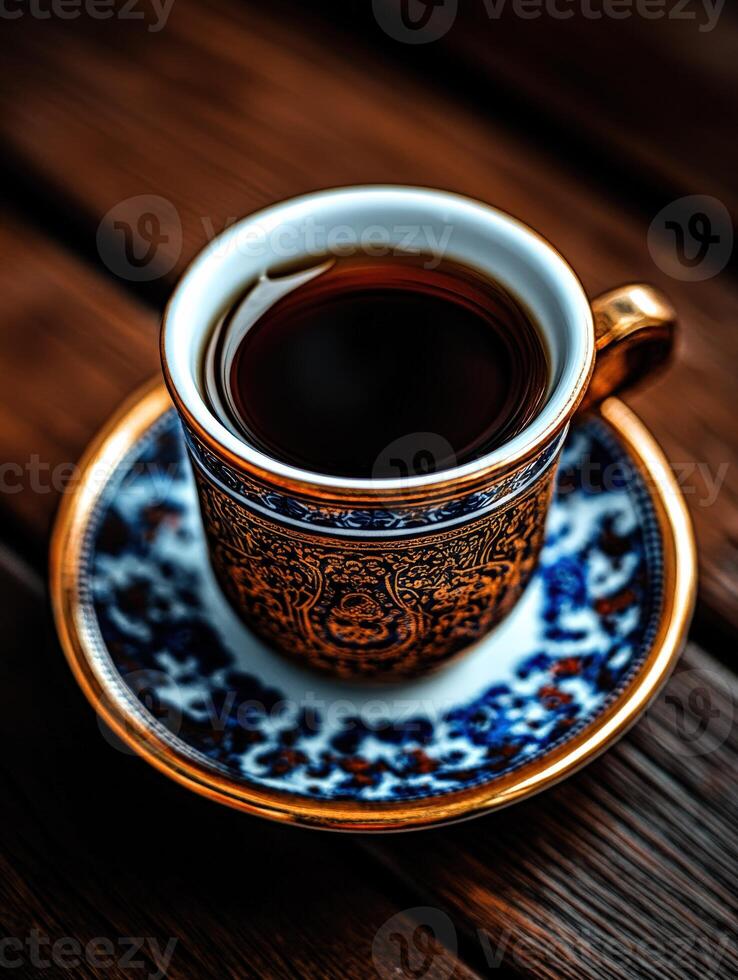 Elegant coffee cup with intricate design on a wooden table photo