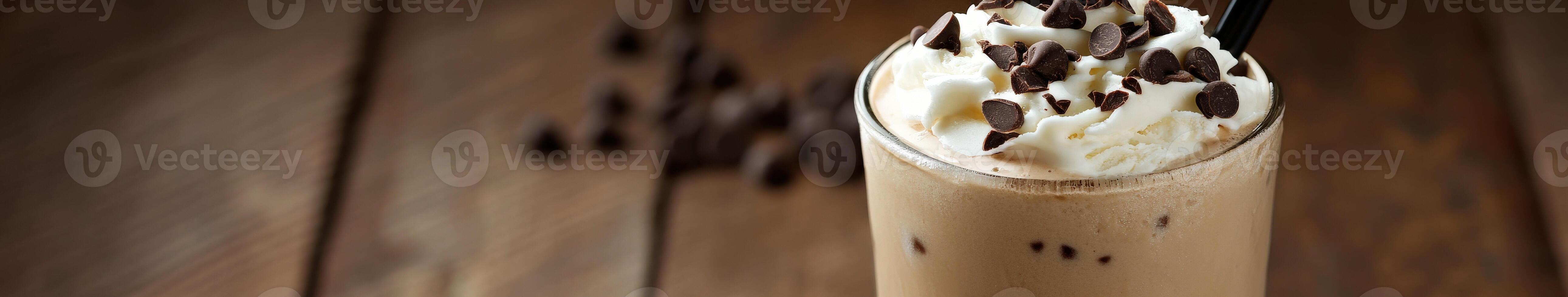 Creamy ice cream drink topped with whipped cream and chocolate chips photo