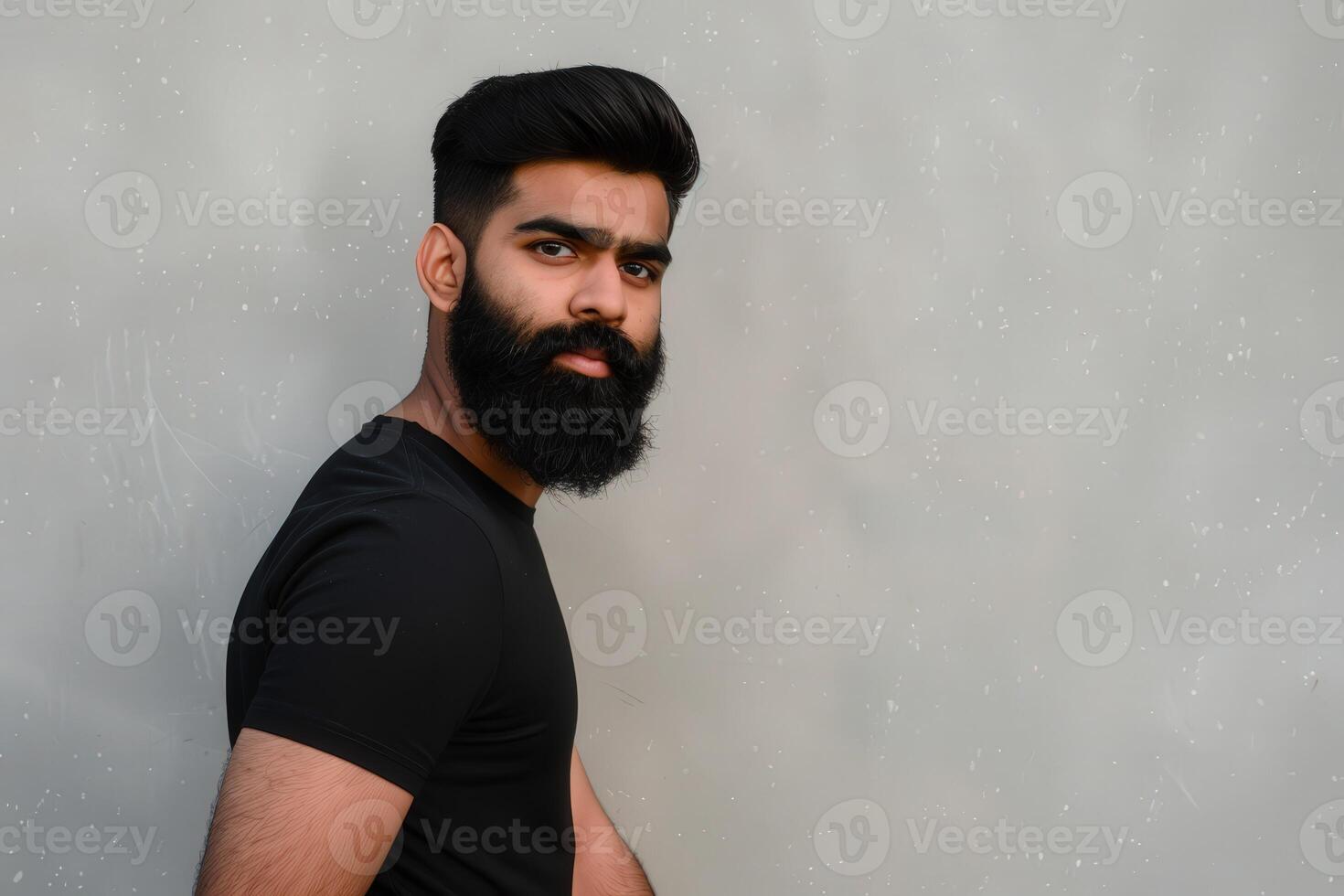 Muslim Man With Beautiful Beard Posing Against Neutral Background photo