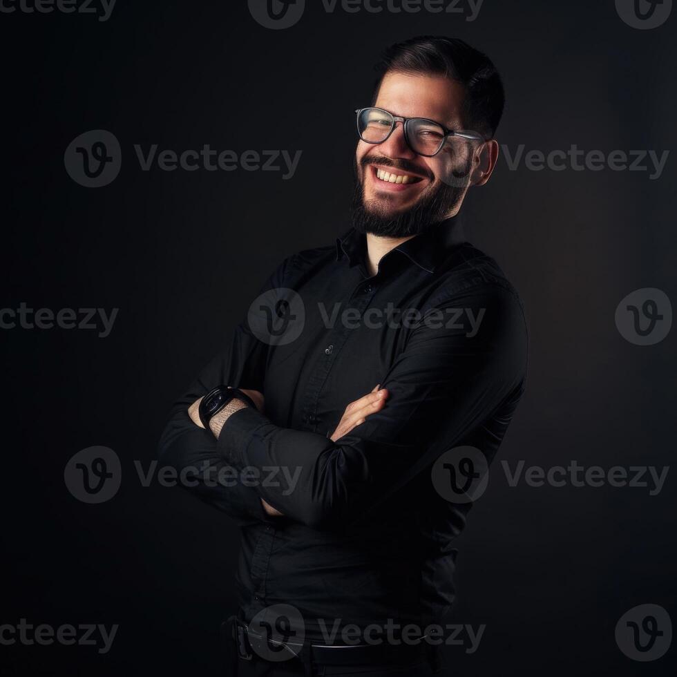 Smiling Male Executive in Black Outfit Posing in Dimly Lit Environment photo