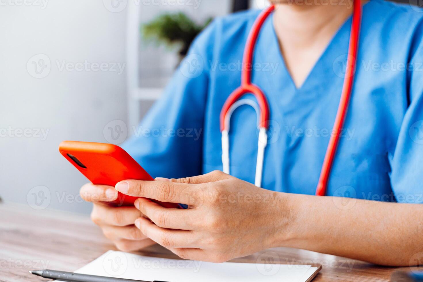 doctor using mobile phone, health staff using a phone. photo