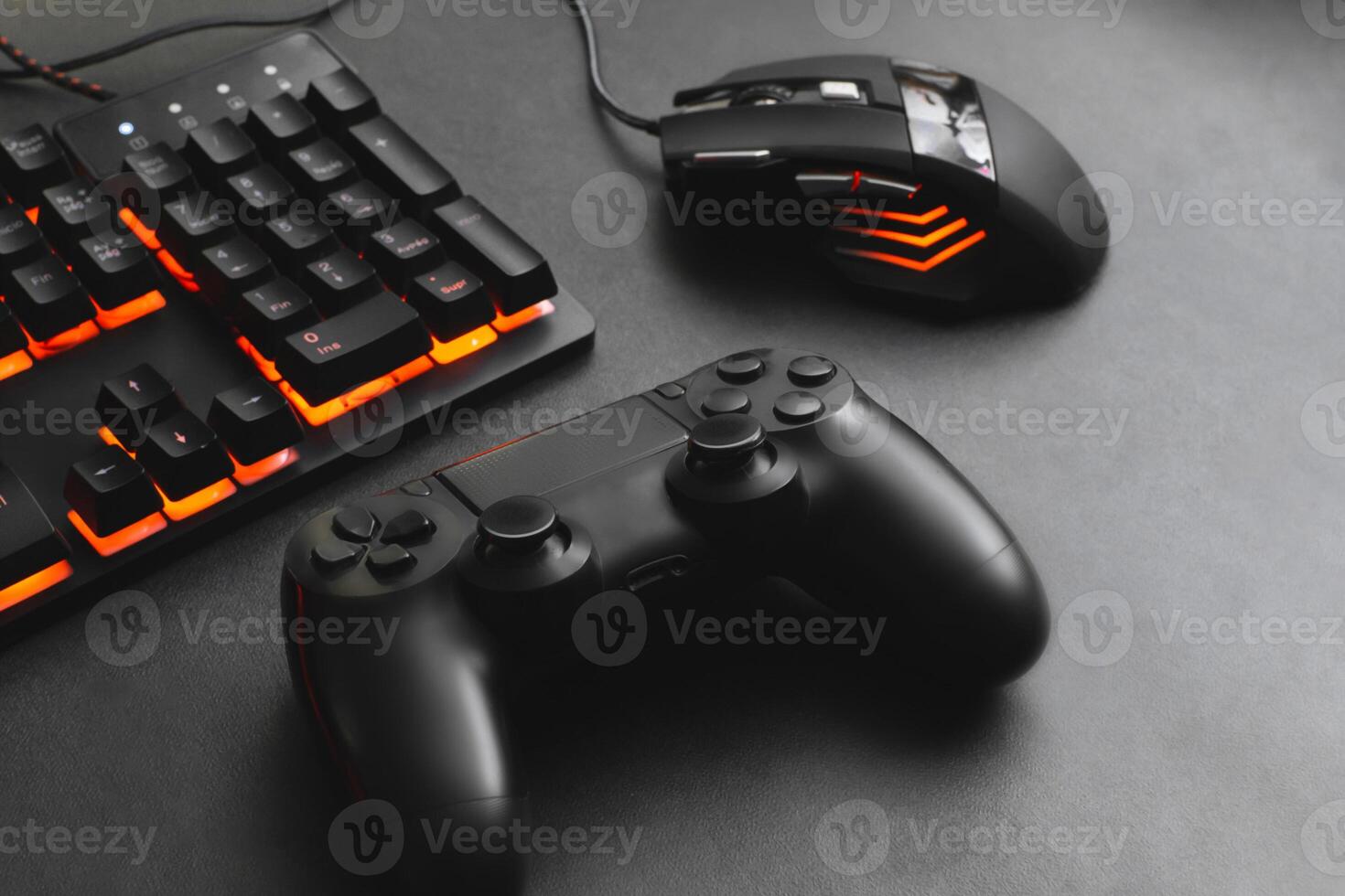A keyboard and mouse for gamer together a joystick concept for online games. photo