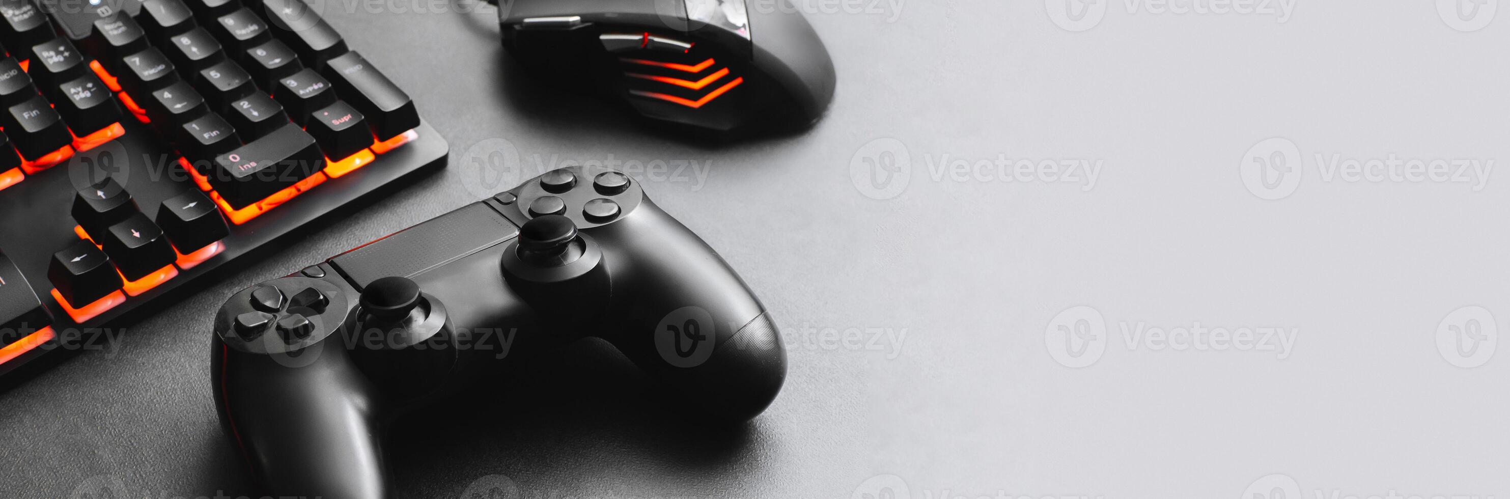 Horizontal banner of a keyboard and mouse for gamer together a joystick concept for online games. photo
