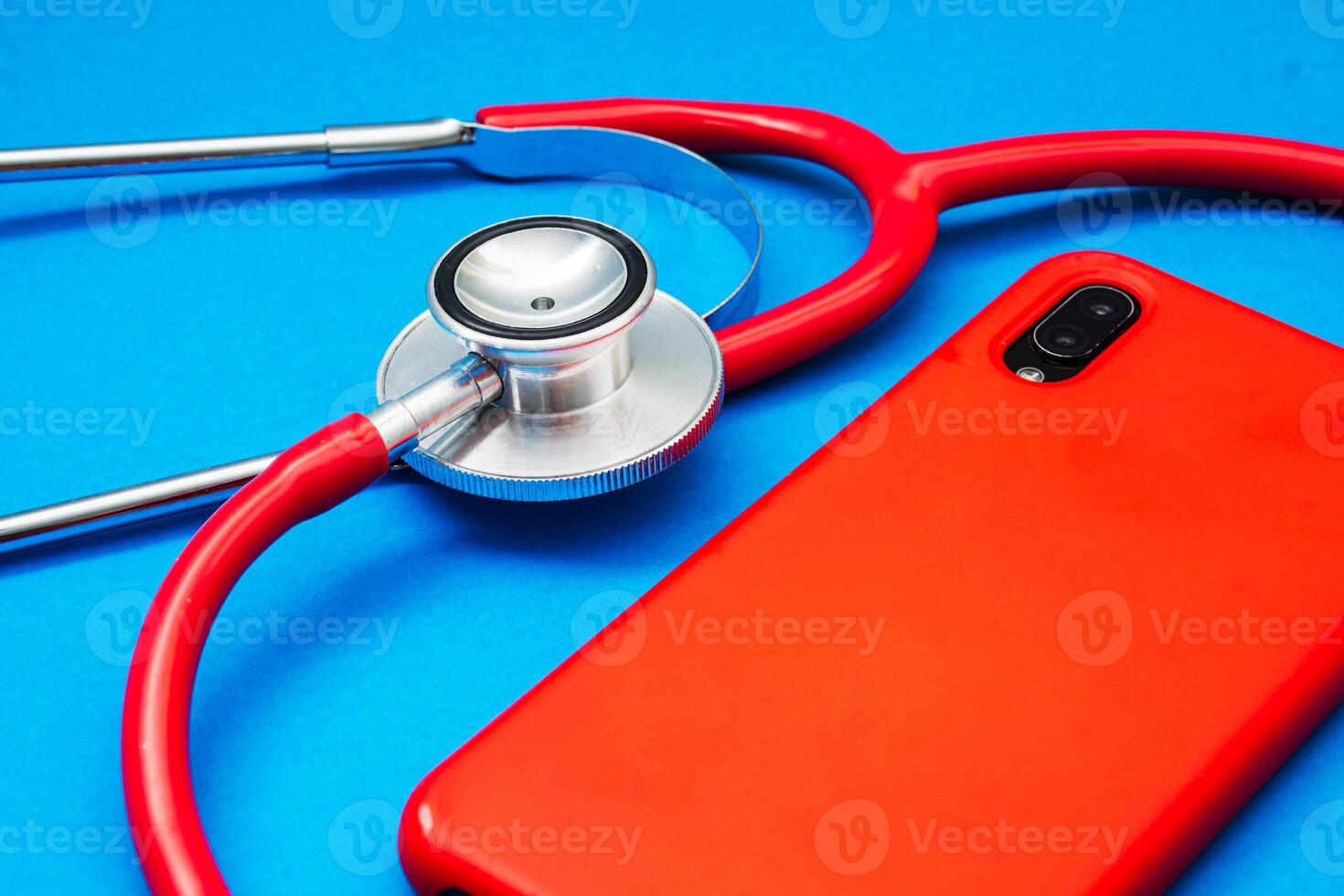 Close Up of a stethoscope and a mobile phone. technology and health concept. photo