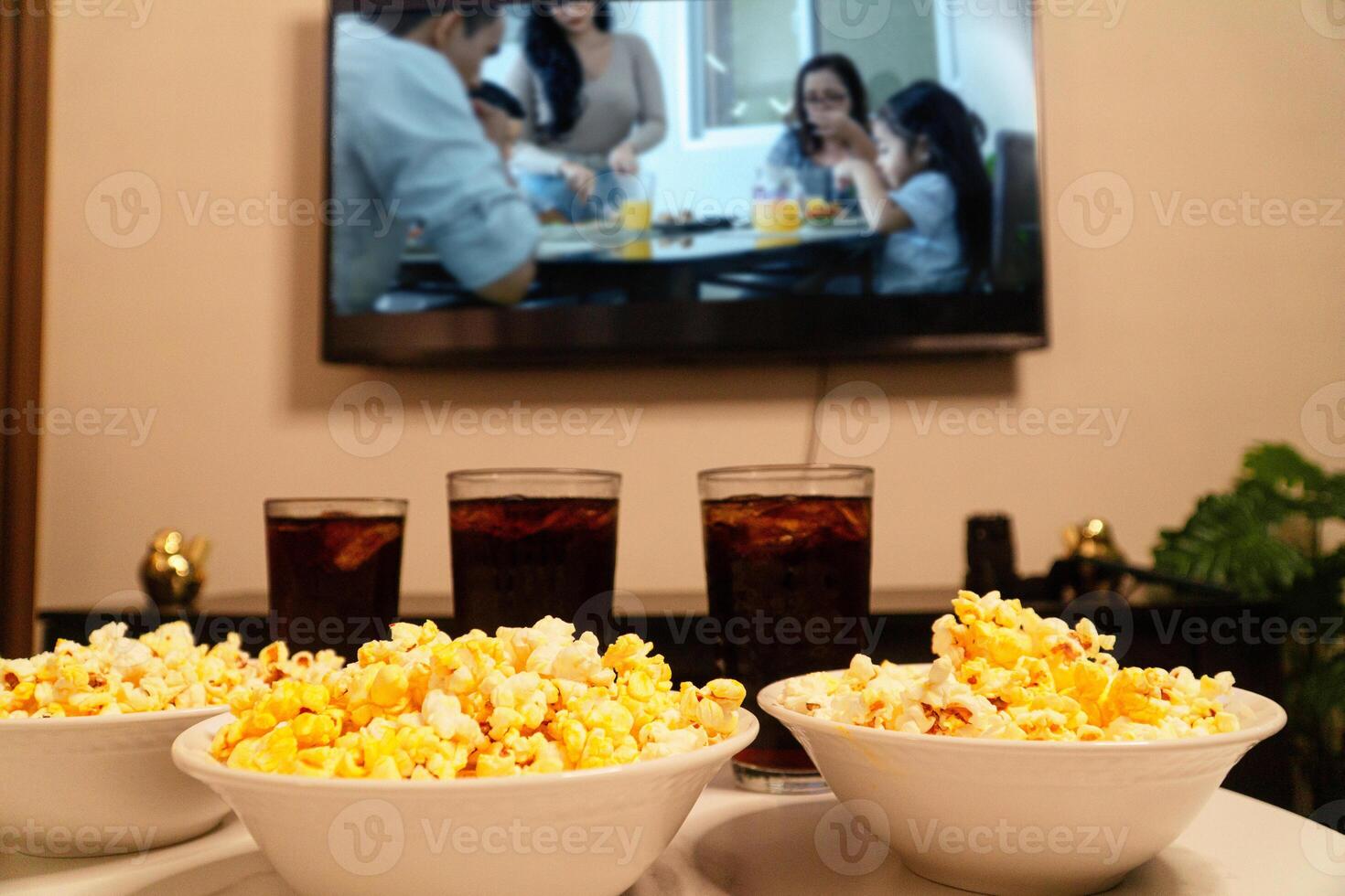 Couple of glasses cup with soda drink and bowls with popcorn. Movie and family time. photo