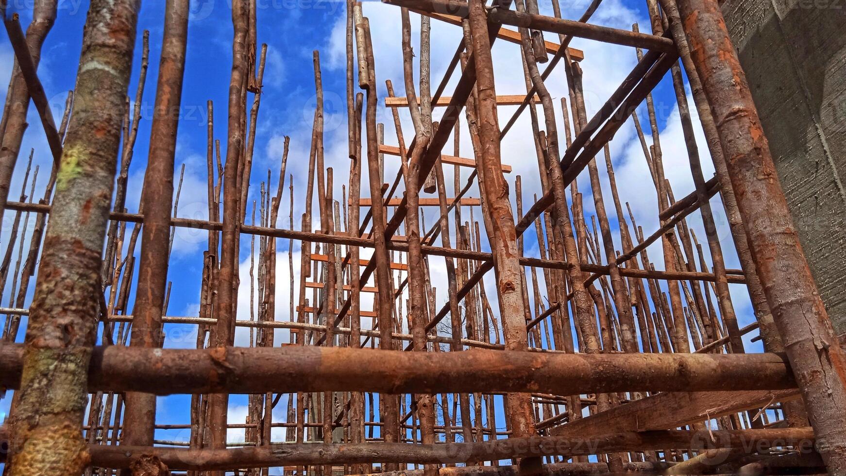 Wooden formwork scaffolding is installed to build the concrete floor slab photo