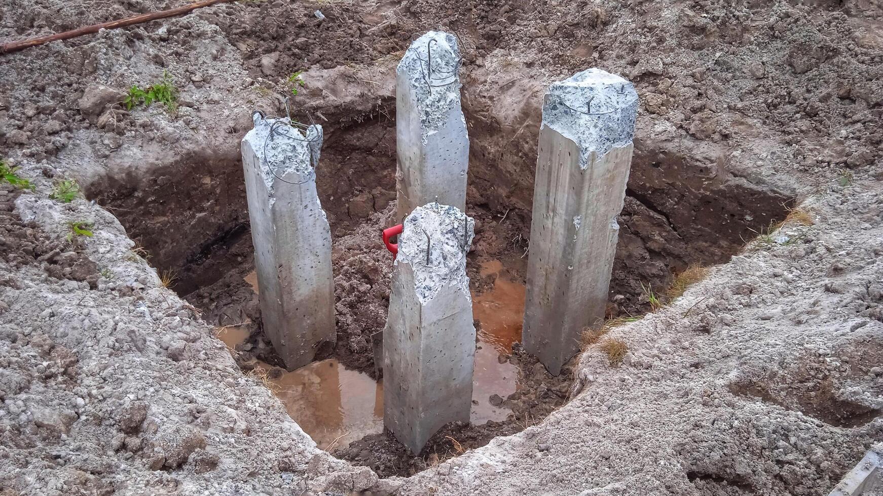 Concrete piles for building foundation photo