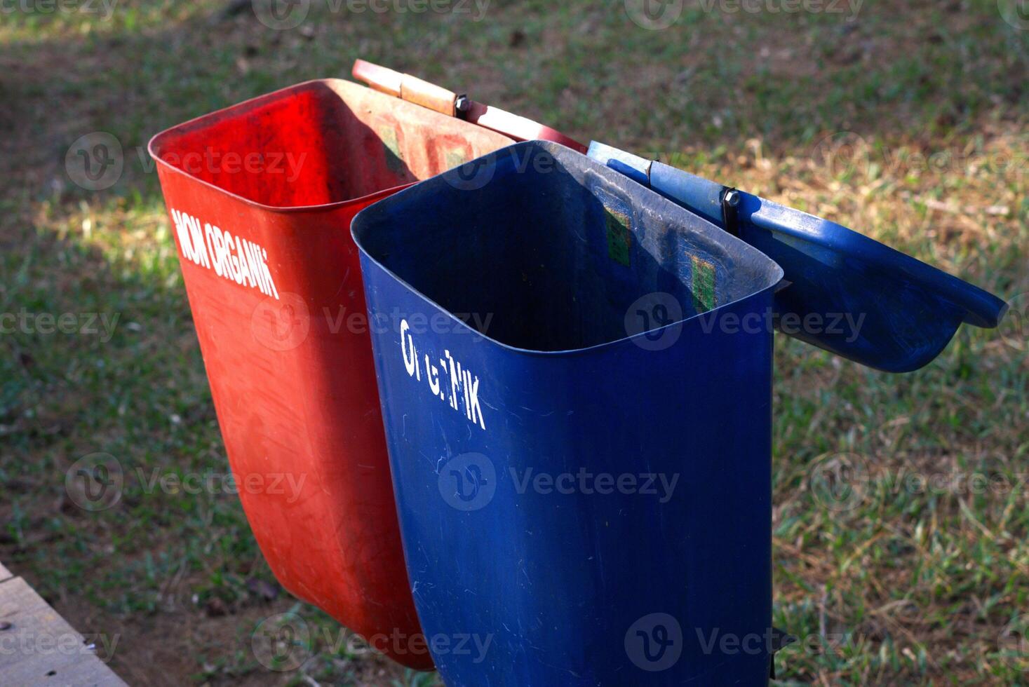 Colorful trash bin in the public park with text means organic and non organic for trash separation photo