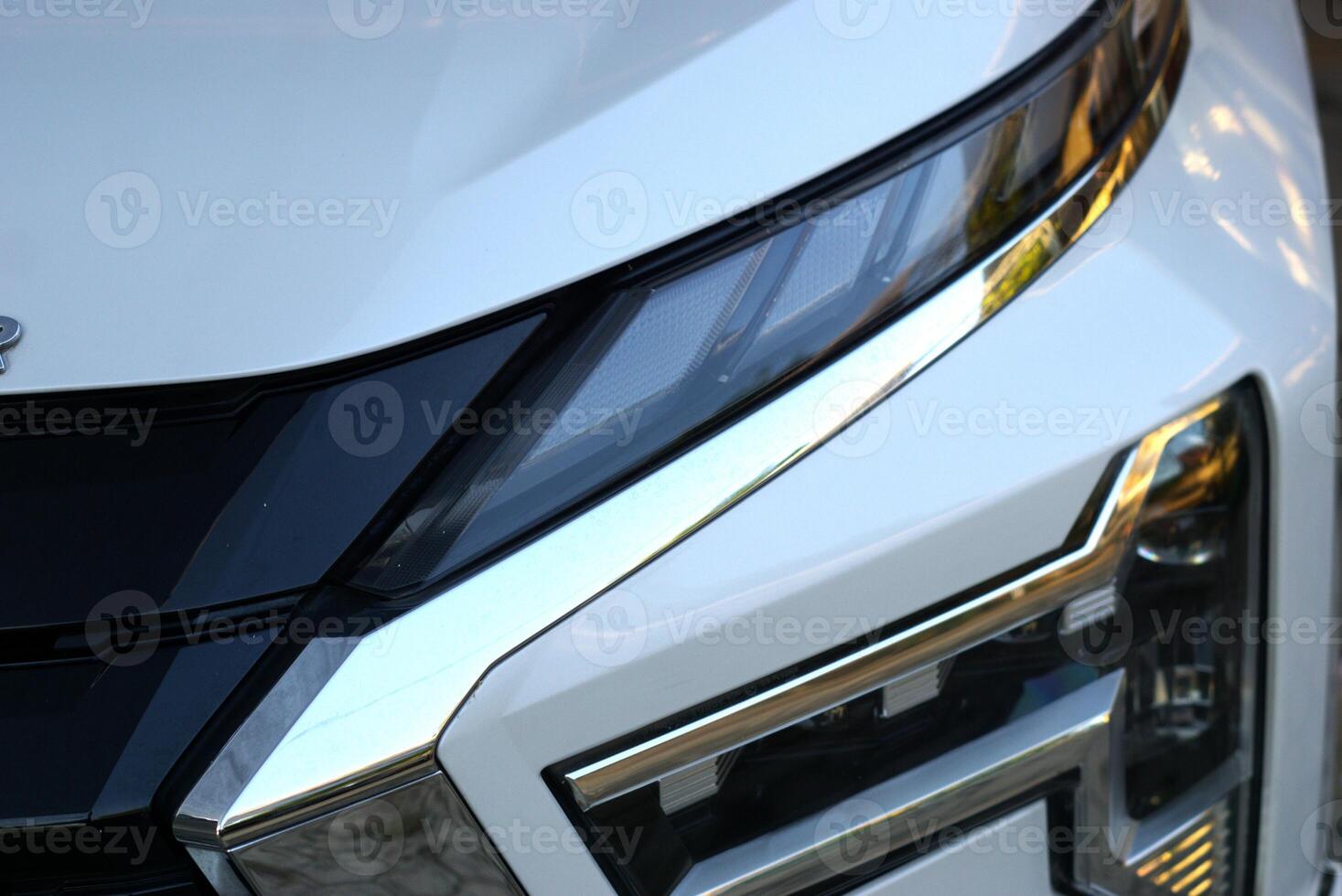 Close up of headlamp of a car photo