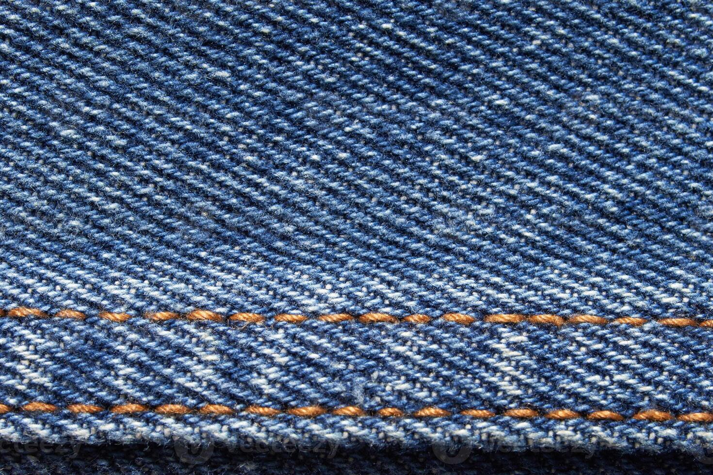 Blue jean texture. Blank denim cloth textile background. Soft fabric. Flat cotton surface. Grunge structure design. Dark navy material. Indigo vintage style. Copyspace photo