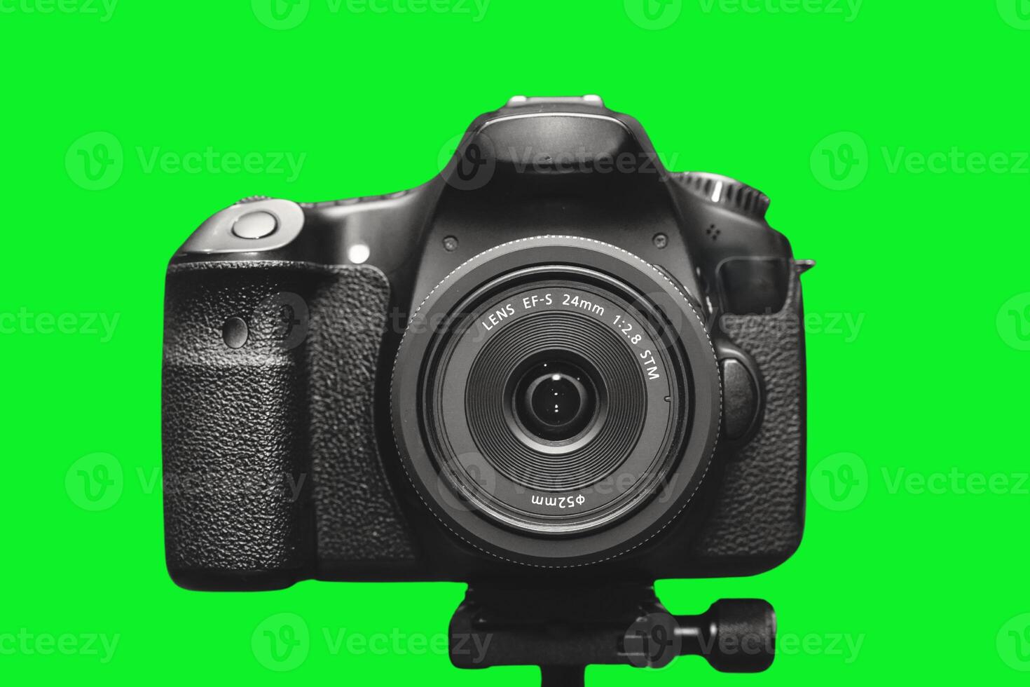 DSLR camera with green background photo