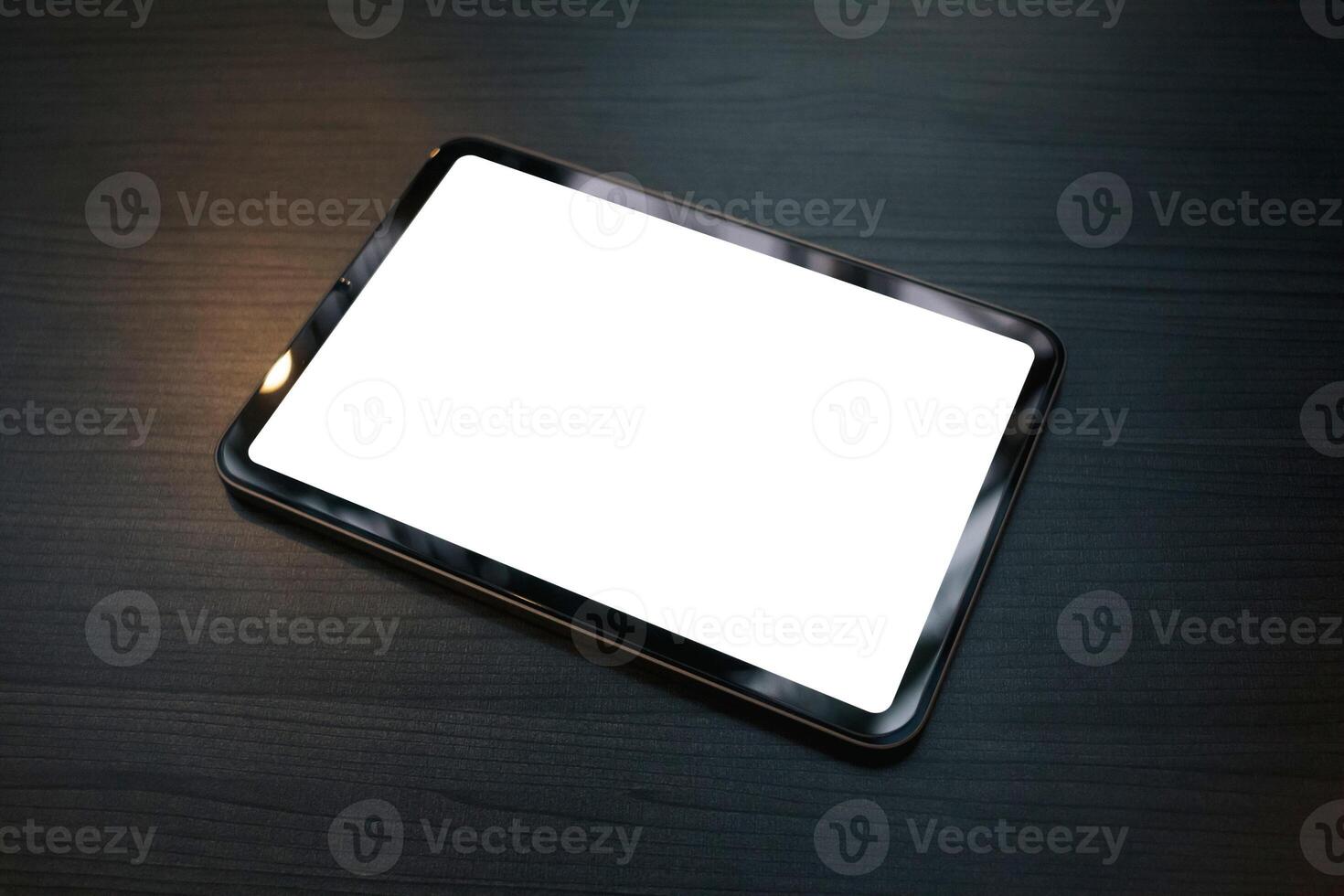 a Top view of a tablet with a blank white screen photo