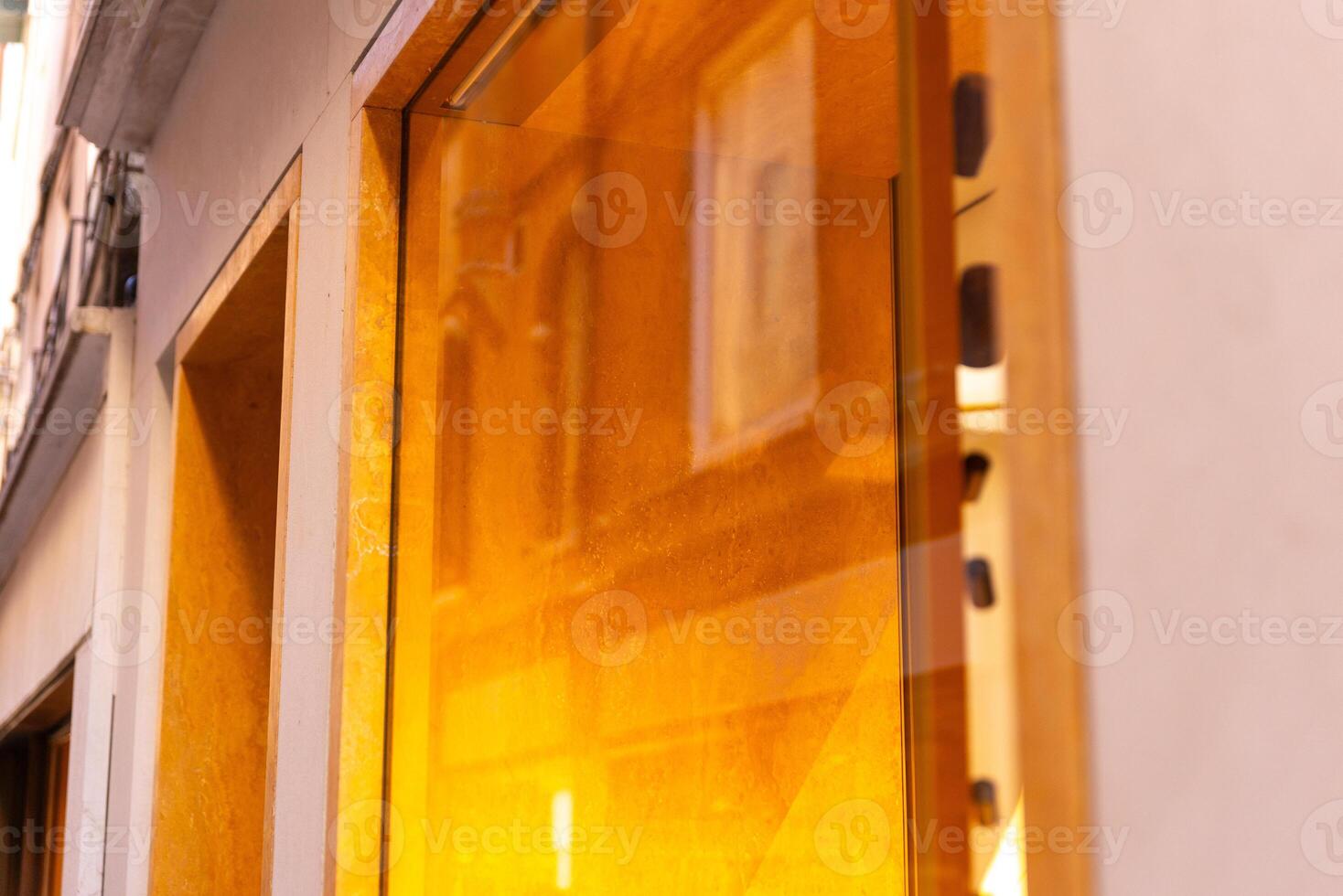 Illuminated shop window. Blank window with space for logo mockup and branding presentation. Ideal for retail advertising, marketing displays, and promotional designs. photo