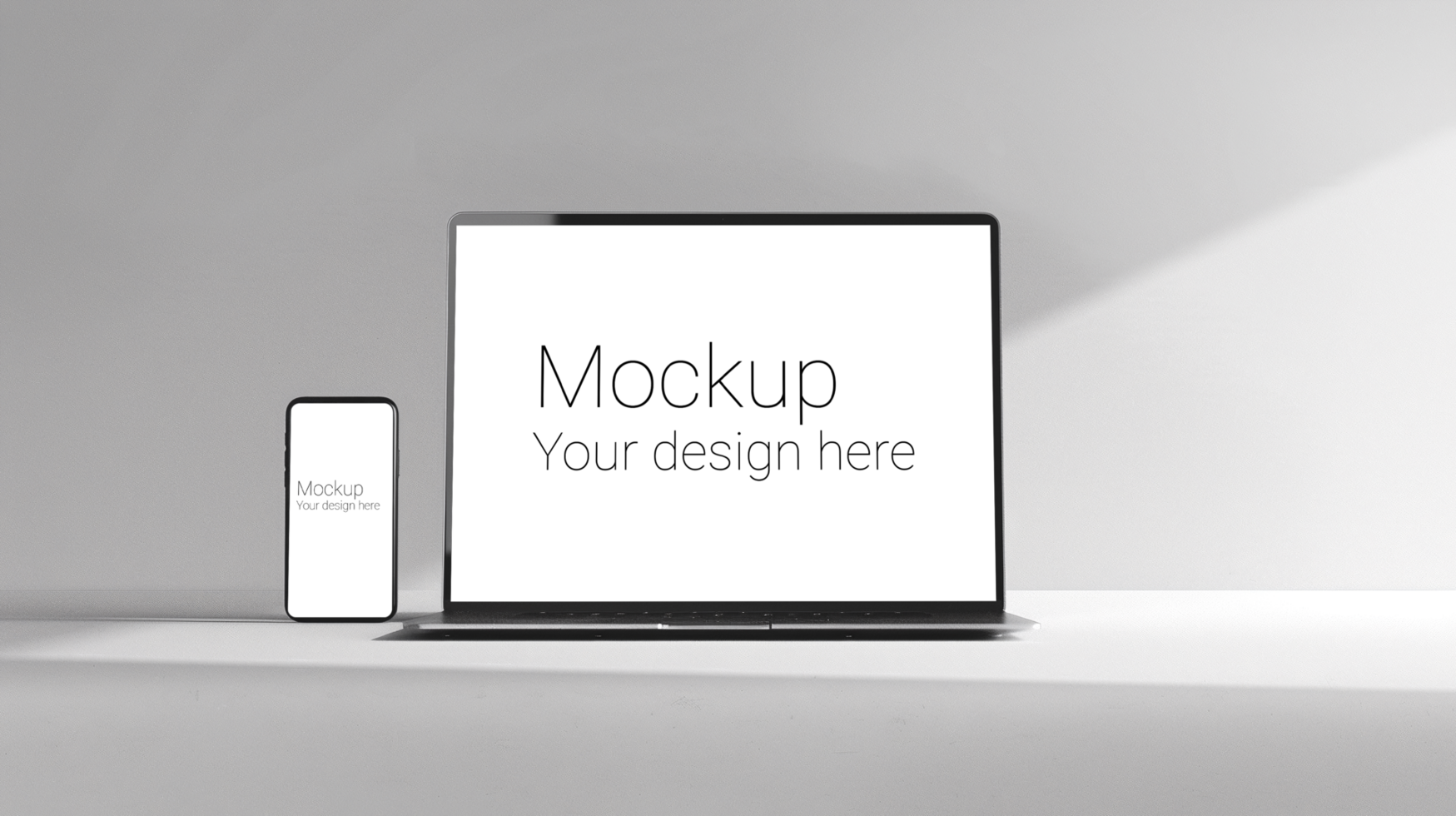Mockup of laptop and phone on gray background psd