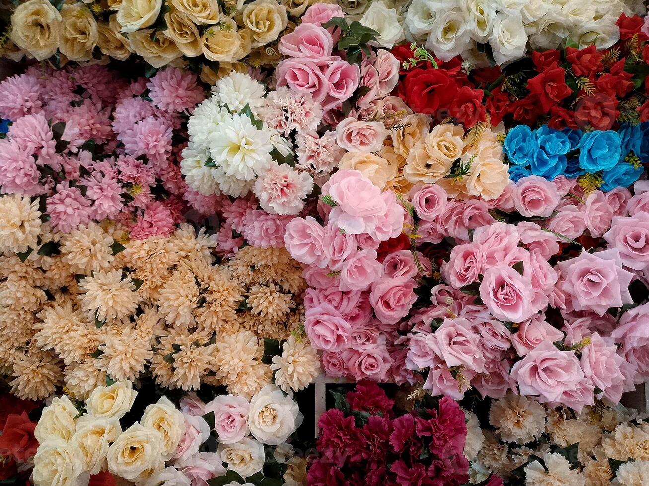 Different color of artificial flowers in the shop photo
