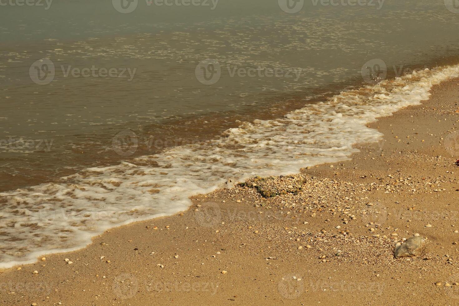 Redang beckons with its beautiful beach landscape, adorned with ornamental charm under the vast blue sky on a bright holiday day pictured with long shutter exposure. photo