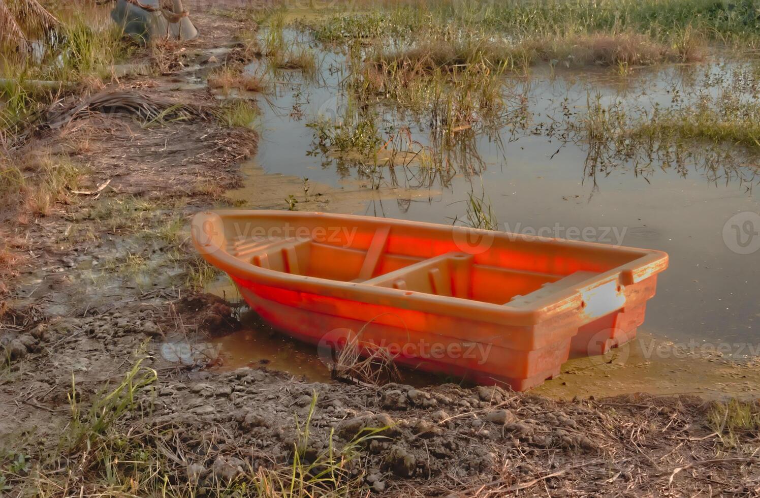 The picturesque small boats, with their lush paddy fields surrounding them and scenic landscape, have become a popular attraction for tourists at Sekinchan Malaysia. photo
