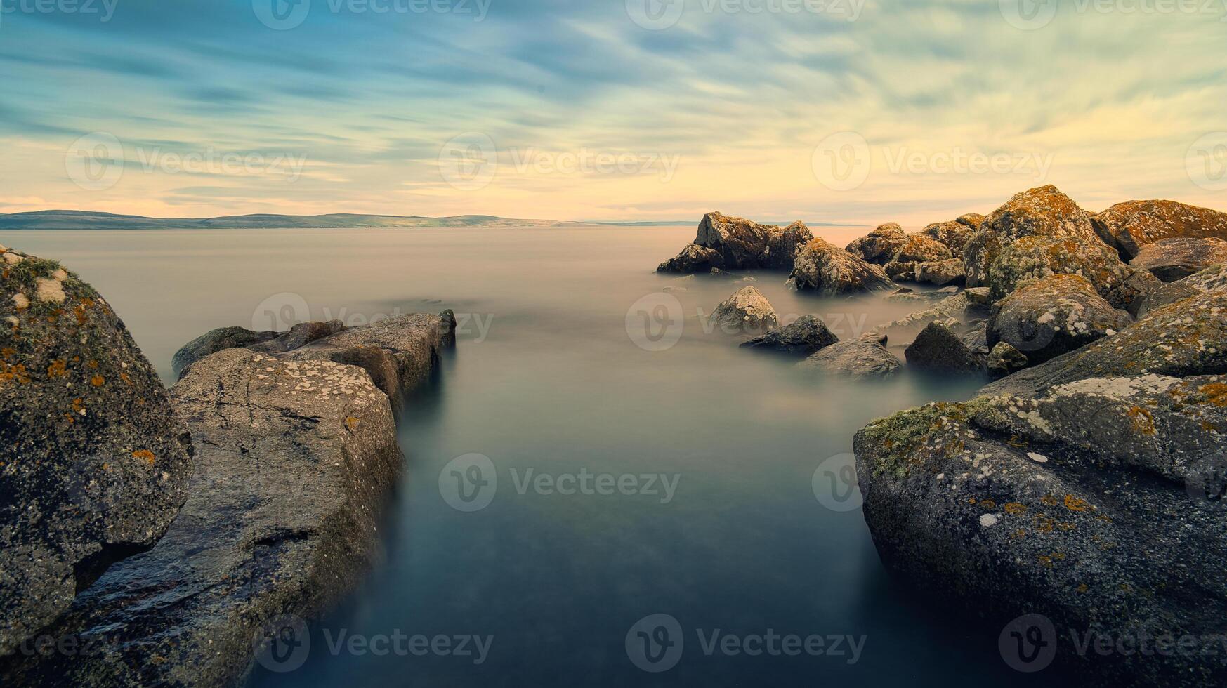 Beautiful coastal landscape scenery, rocky coast of wild Atlantic way at sunset, nature background, wallpaper, long exposure photo
