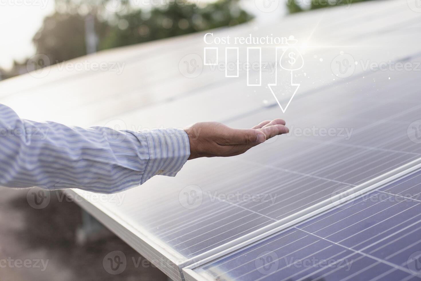 Financial concept to reduce cost of renewable energy business, budget and cost management, efficiency, strategy, economic cost saving, people holding cost icon on virtual screen. photo