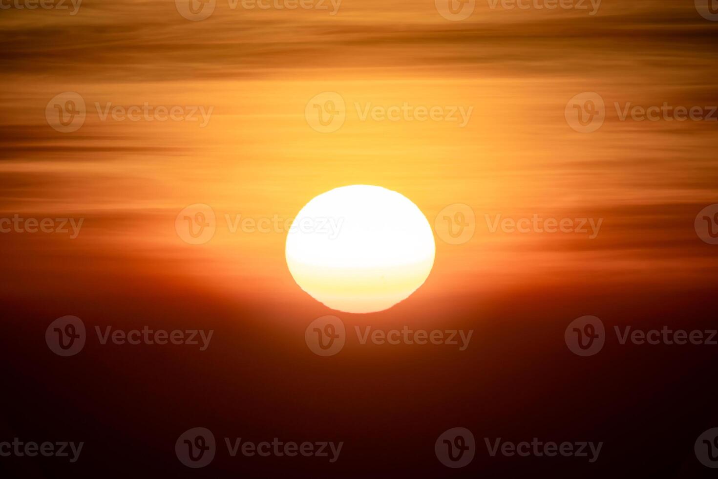 The sun is rising in the dark environment for any hopeful concept background. Its shot at Thailand in January 2022. photo