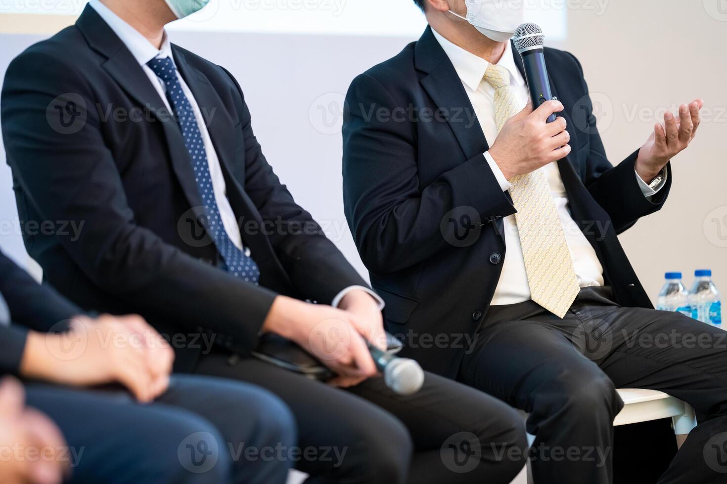 Speaker, who is holding microphone, is discussing how to start business as well as politics, which is difficult topic to find because it is sensitive issue in Thailand. photo