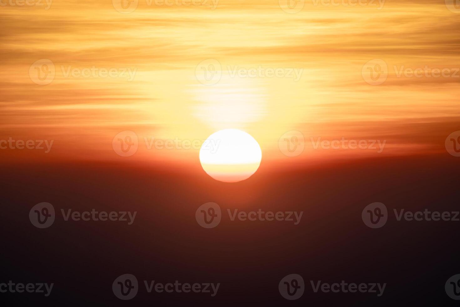 The sun is rising in the dark environment for any hopeful concept background. Its shot at Thailand in January 2022. photo