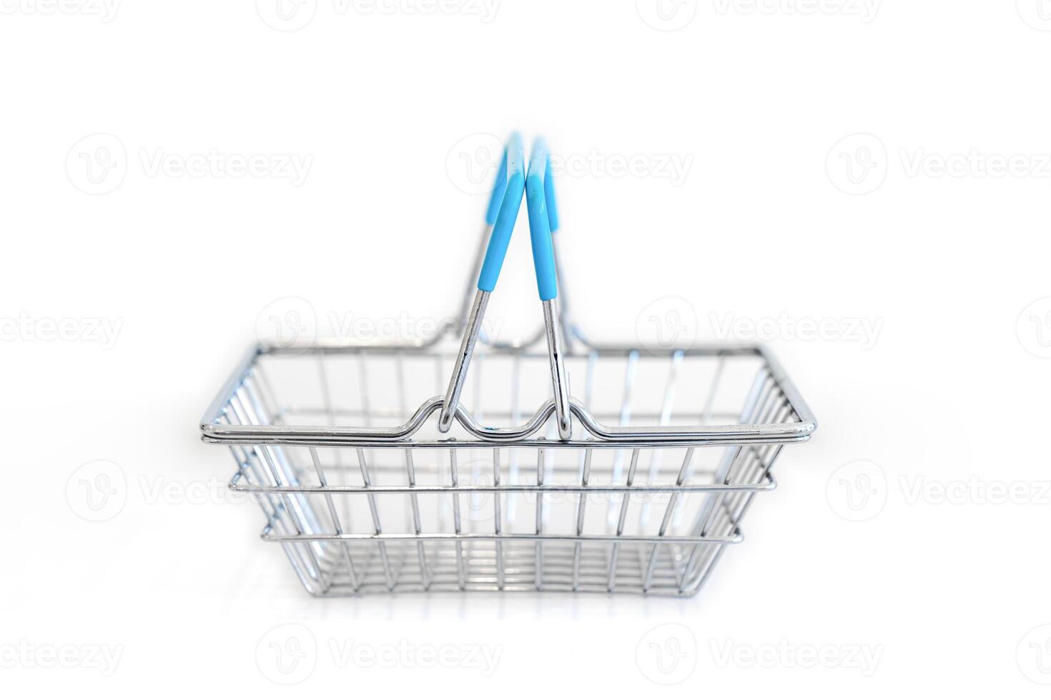 Symbolic of shopping online, the empty mini basket on white background. photo