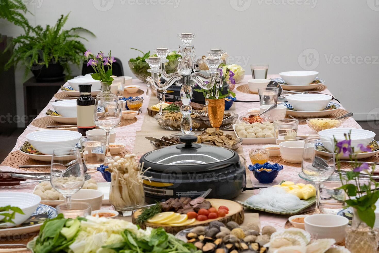 Sukiyaki Premium and Luxury Dinner Set for Celebration with special VIP guests. They have the raw material, beef, pork, chicken, egg, tofu, vegetable, shrimp, shell, squid. photo