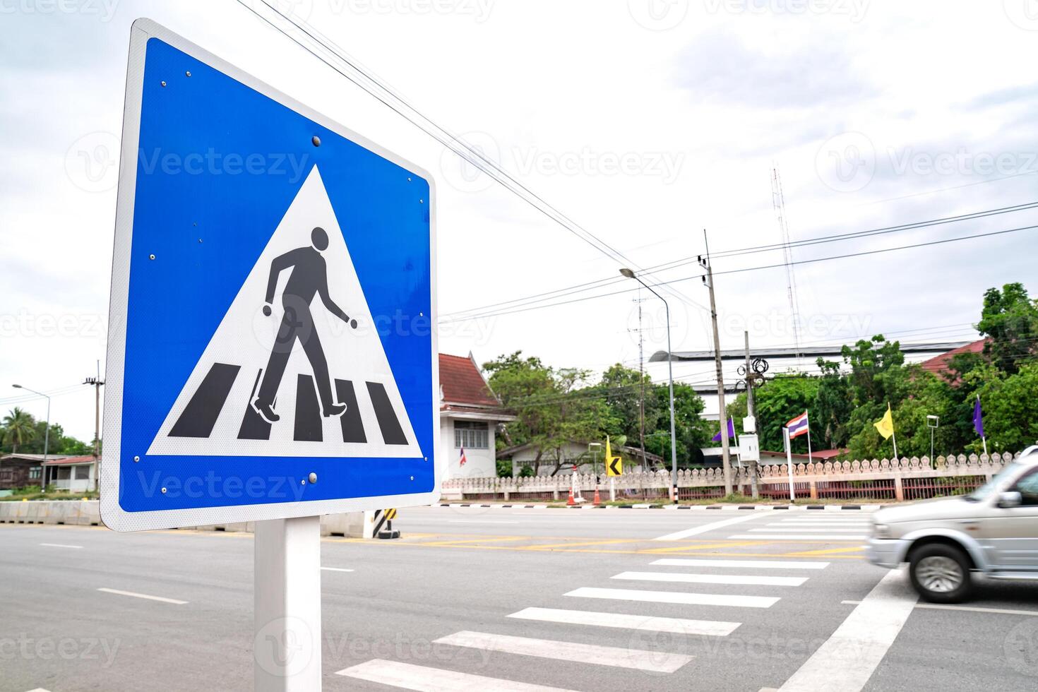Zebra cross sign beside the road at Thailand. photo