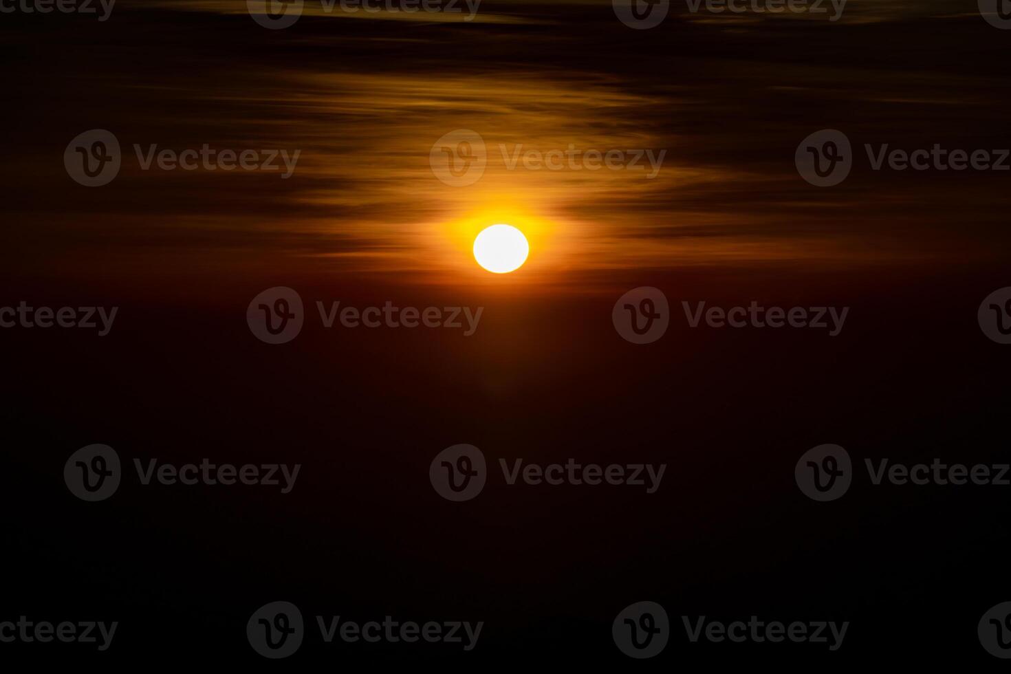 The sun is rising in the dark environment for any hopeful concept background. It shot at Thailand in January 2022. photo