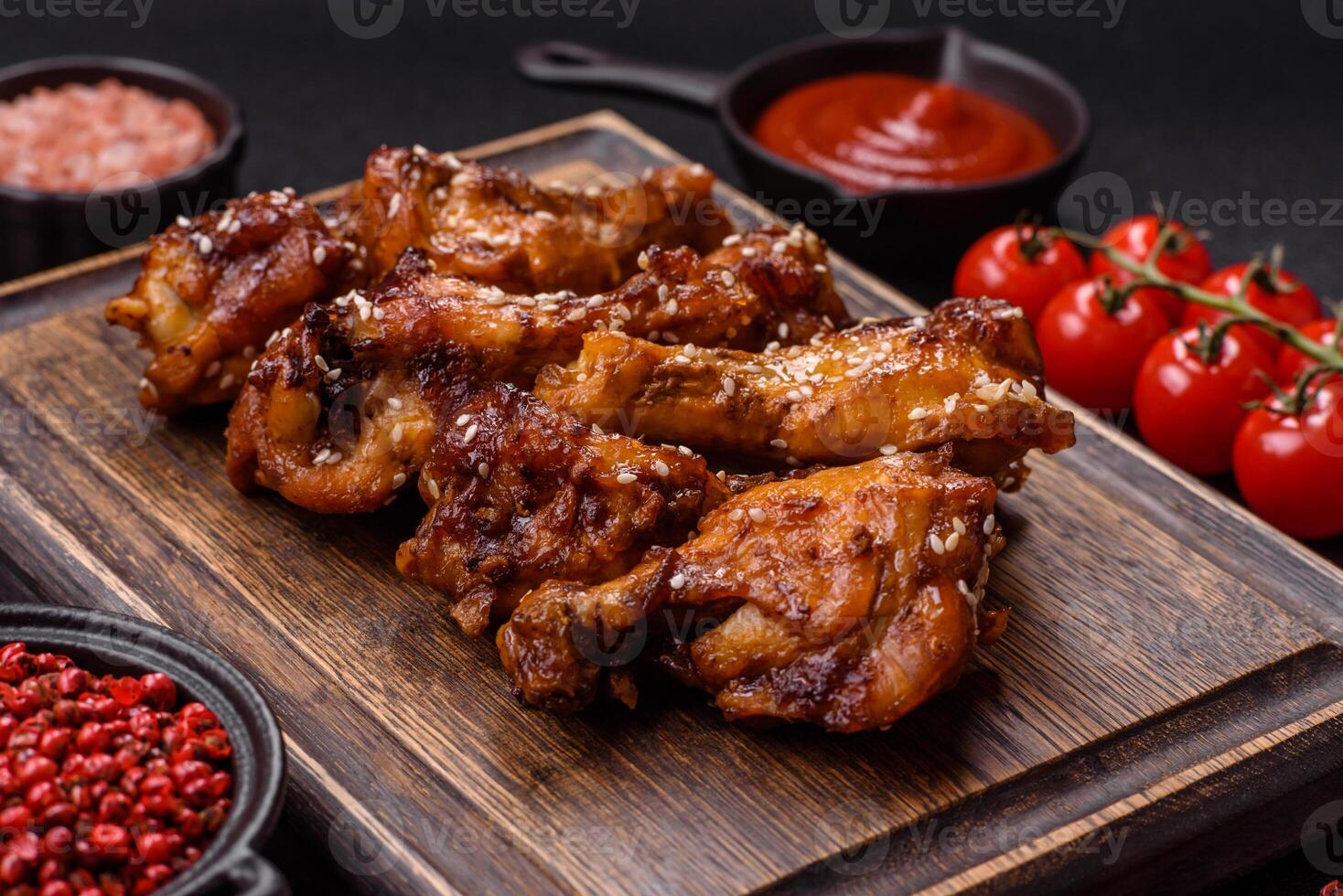Delicious crispy baked chicken wings in teriyaki sauce photo