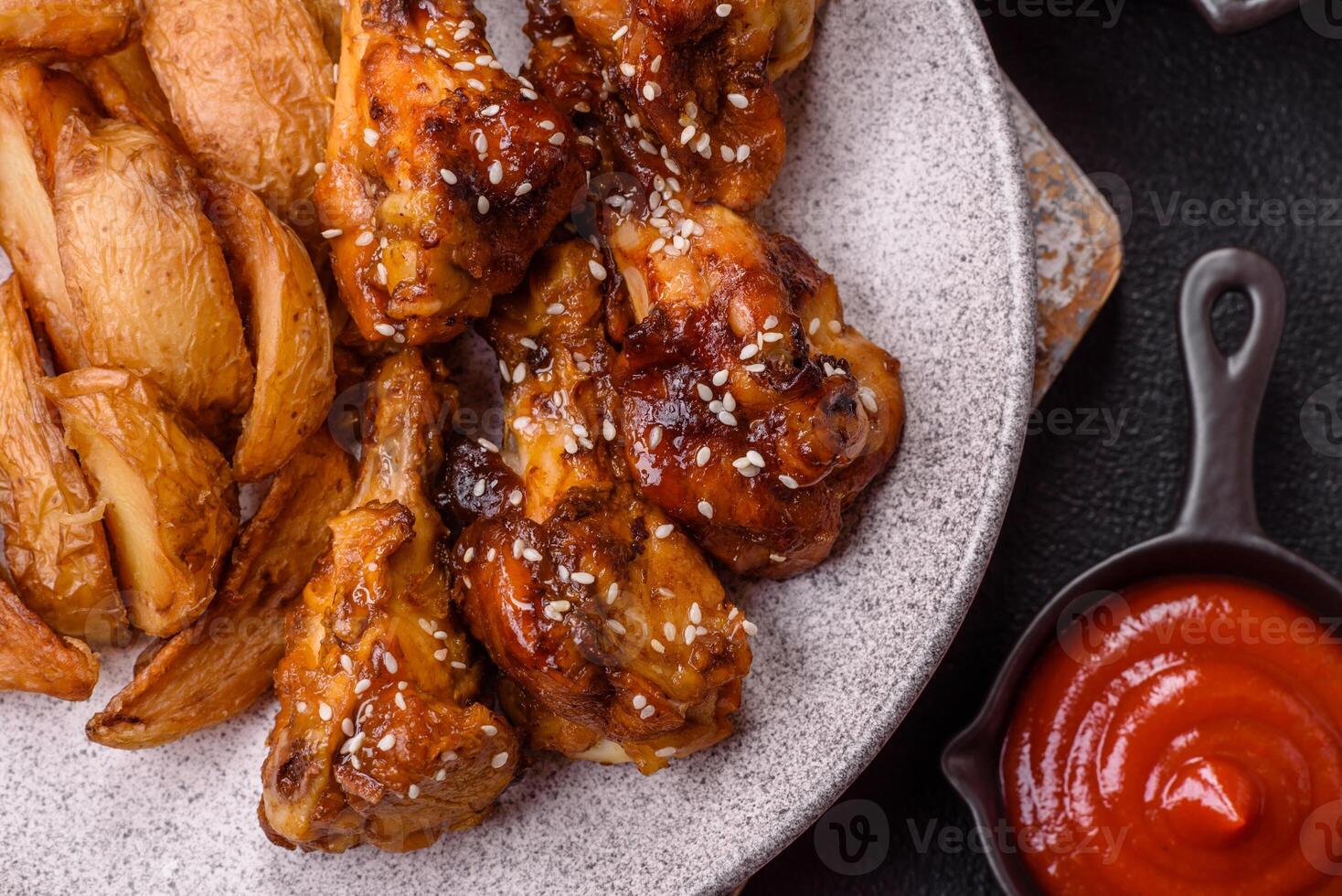 Delicious crispy baked chicken wings in teriyaki sauce photo
