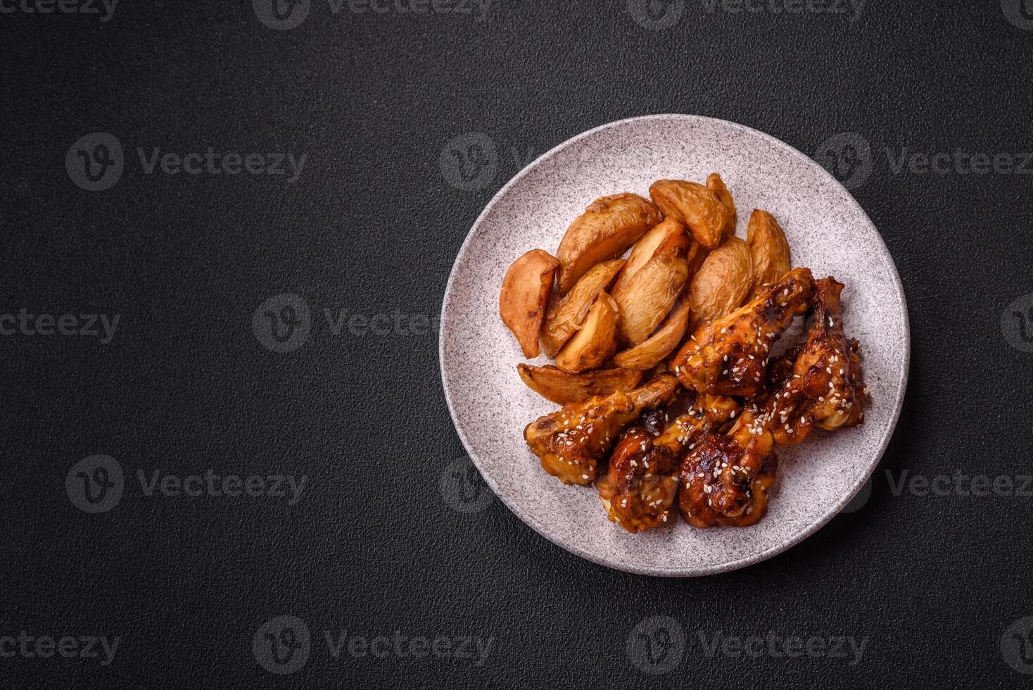 Delicious crispy baked chicken wings in teriyaki sauce photo