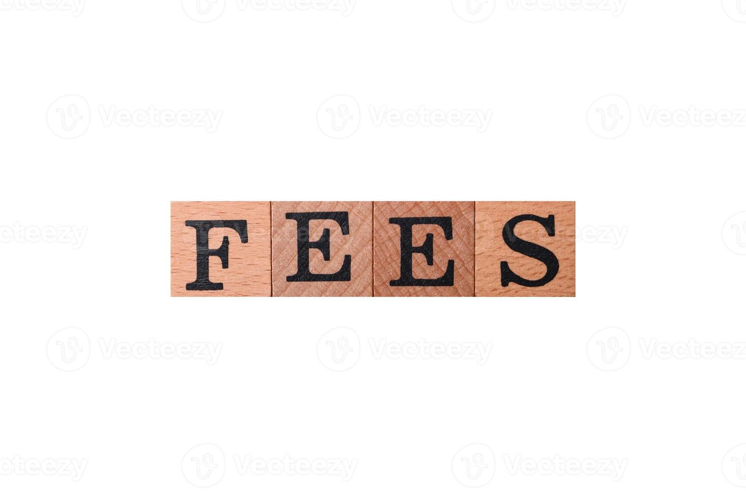 Inscription Fees with wooden cubes, conceptual background with copy space photo