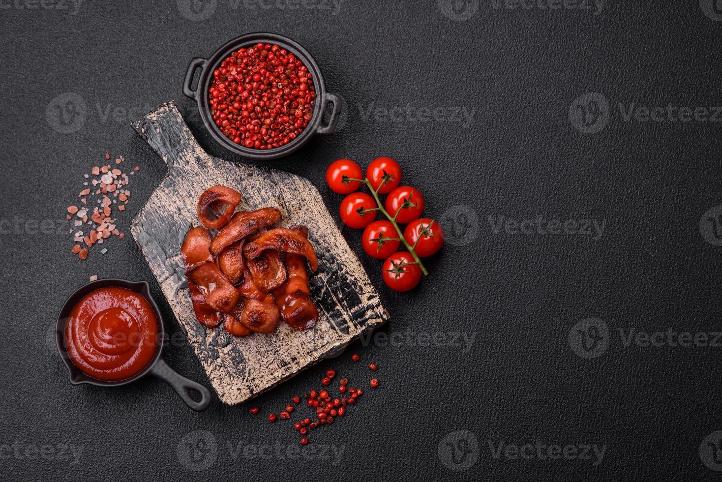 Fried sausages sliced with salt and spices as an ingredient for an English breakfast photo