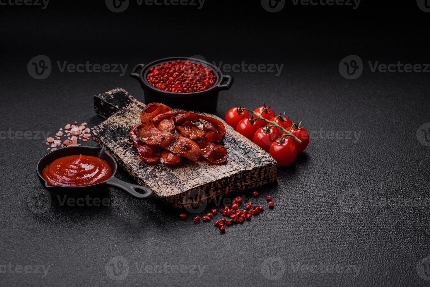 Fried sausages sliced with salt and spices as an ingredient for an English breakfast photo